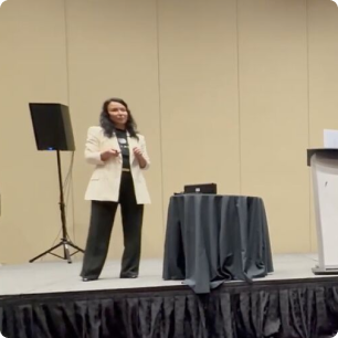 SUPERAGENT presenting on stage